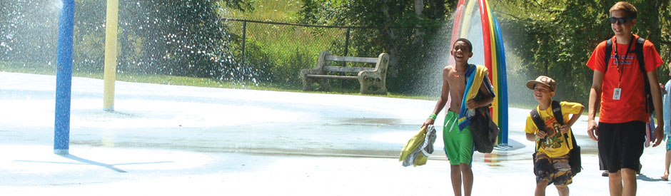 Two children and a camp counsellor at Brant's Splashpad