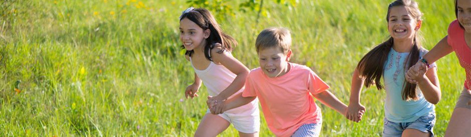 happy kids running in a field