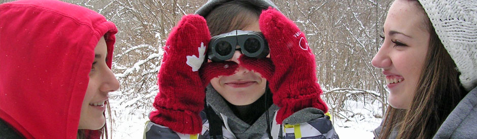 High school kids outdoors with binoculars